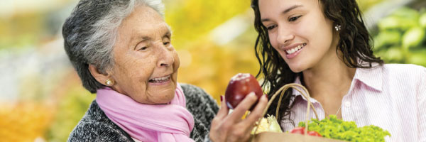 grandma and daughter with apple